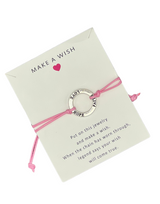 HOPE,FAITH,LOVE RING SHAPED CHARM BRACLETE WITH SLIDER KNOT ON BABY PINK STRING