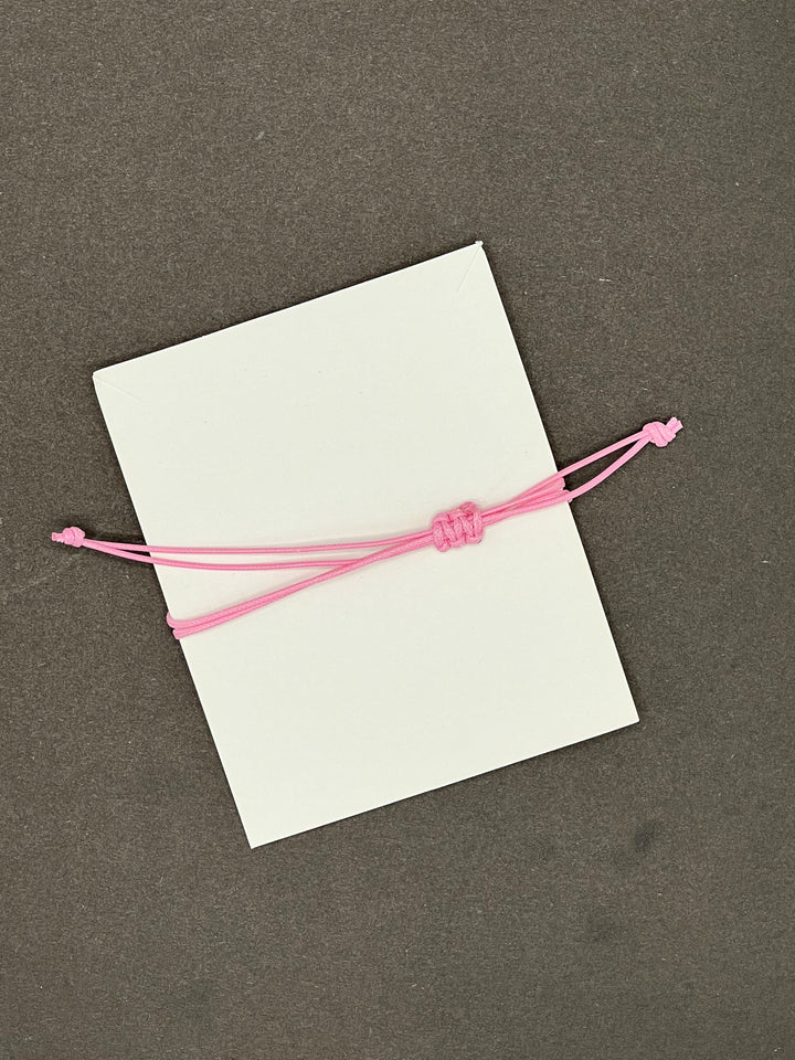 HOPE,FAITH,LOVE RING SHAPED CHARM BRACLETE WITH SLIDER KNOT ON BABY PINK STRING